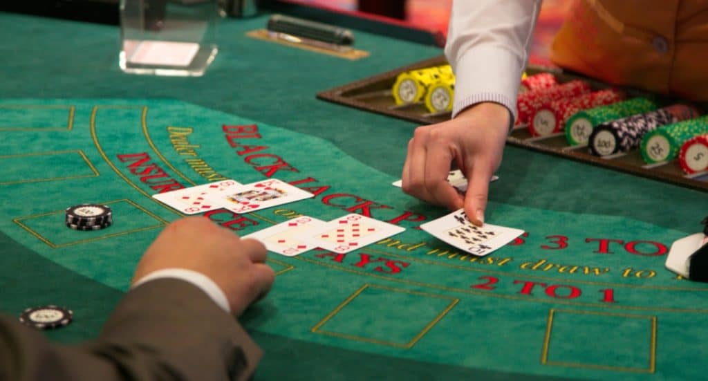 Player doubling down at the blackjack table.